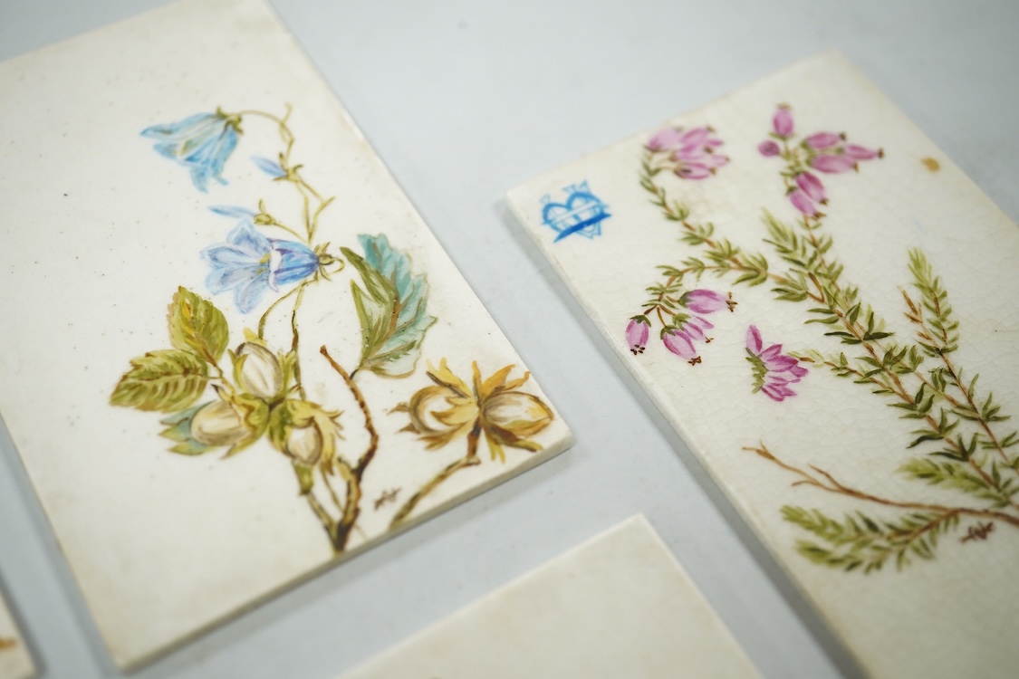 Set of seven late 19th century miniature floral painted pottery plaques, each monogramed 8.5cm high, possibly for place settings